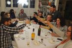 dinner guests toast the meal with carajillos